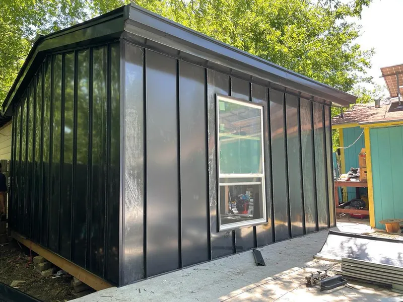 Black standing seam metal wall panels for Roof Inspection in Garland