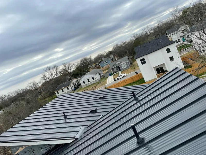 Standing seam metal roof panels with vents for Skylight Repair in Garland